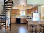 Open Floor Plan Kitchen with Spiral Stair Case to Second Floor